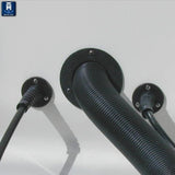 Watertight steering hose bulkhead fitting with strain reliever